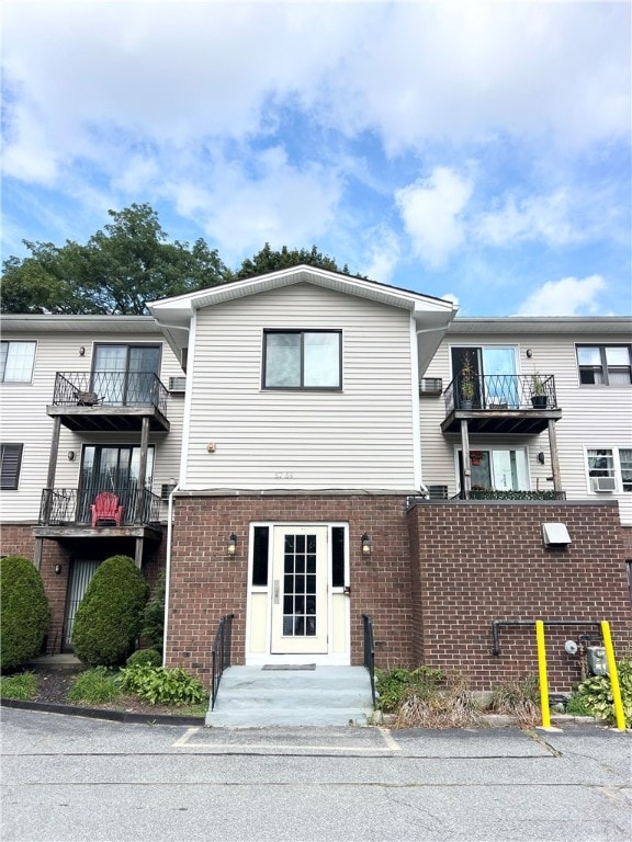 view of front of property with a balcony