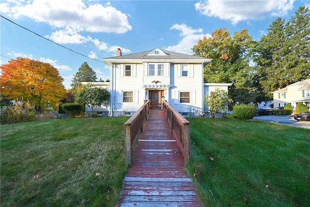 view of front of home with a front yard