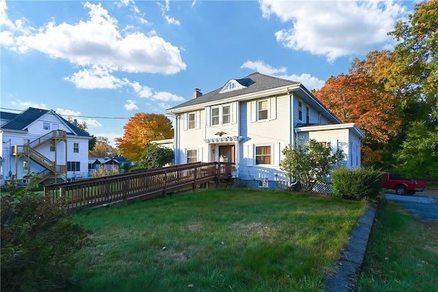 view of front of home with a front yard