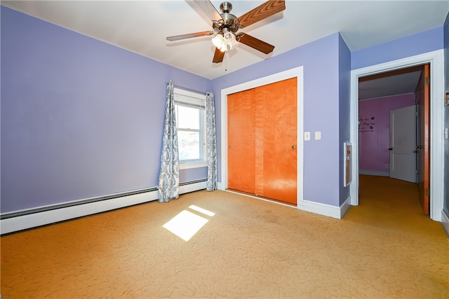 unfurnished bedroom featuring a closet, ceiling fan, baseboard heating, and light colored carpet