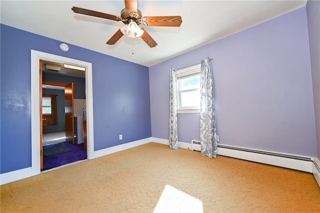 interior space with a baseboard heating unit, carpet flooring, and ceiling fan