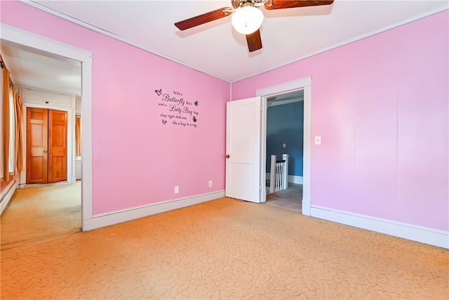 unfurnished bedroom featuring ceiling fan