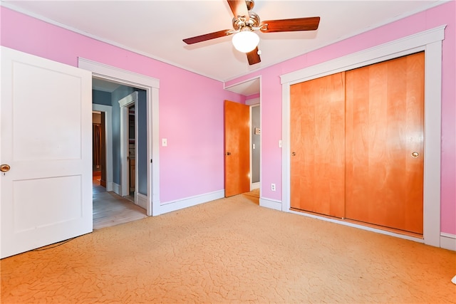 unfurnished bedroom with wood-type flooring, a closet, and ceiling fan