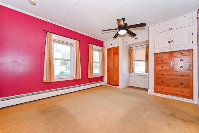 unfurnished bedroom featuring a baseboard radiator, ornamental molding, multiple windows, and ceiling fan