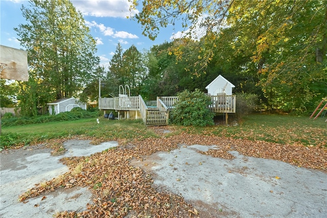 view of yard with a wooden deck