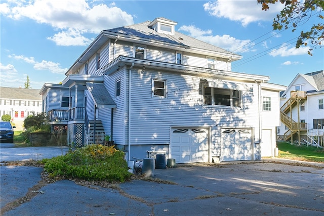 view of side of home with a garage