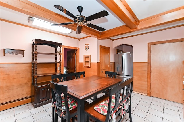 tiled dining space featuring beam ceiling, a baseboard heating unit, and ceiling fan