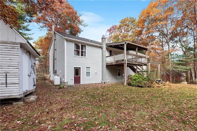 back of property featuring a lawn