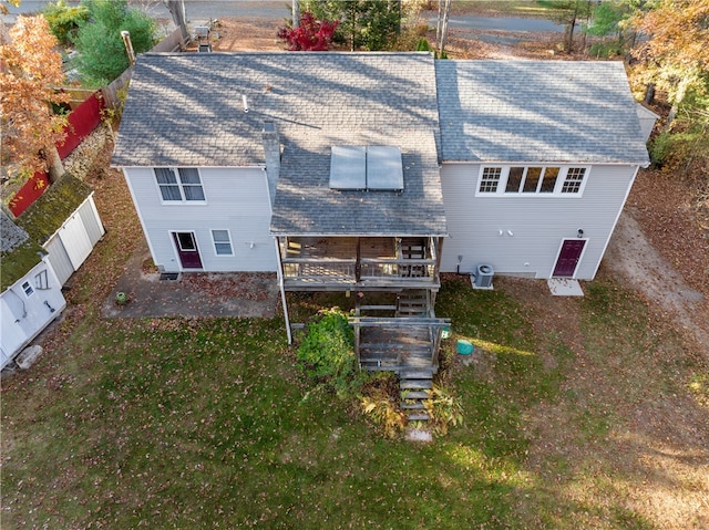 back of house featuring a wooden deck and central AC unit