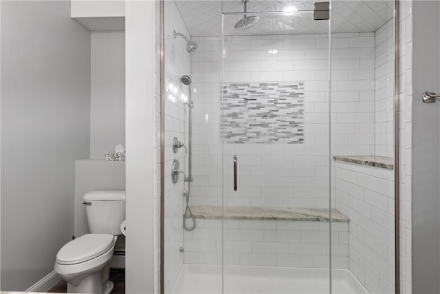 bathroom with toilet and walk in shower