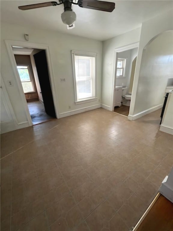 interior space featuring a healthy amount of sunlight and ceiling fan