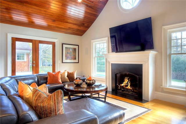 living room with french doors, wood ceiling, vaulted ceiling, and light wood-type flooring