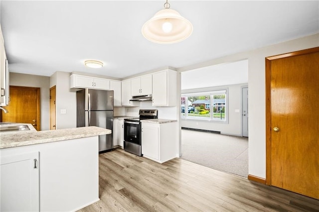 kitchen featuring stainless steel appliances, kitchen peninsula, hanging light fixtures, white cabinetry, and light hardwood / wood-style flooring