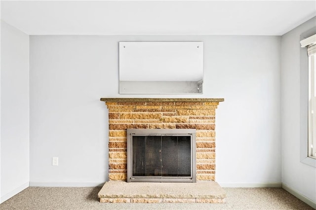 details featuring a brick fireplace and carpet floors