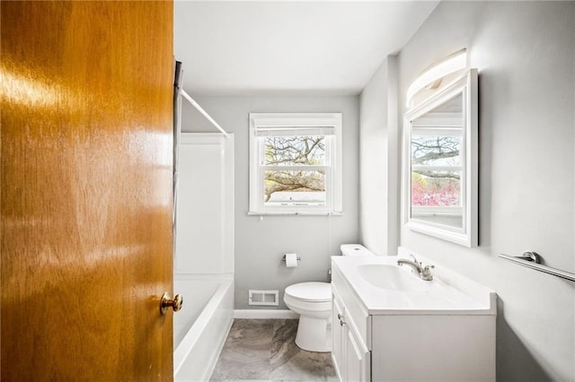 full bathroom with tub / shower combination, vanity, and toilet