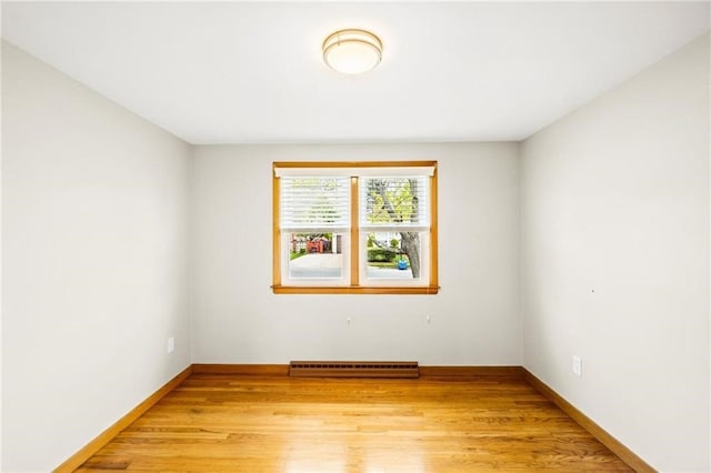 spare room with light hardwood / wood-style flooring