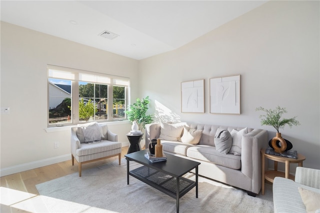 living room with light hardwood / wood-style flooring