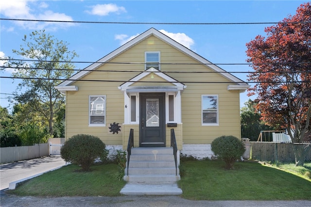 bungalow with a front yard