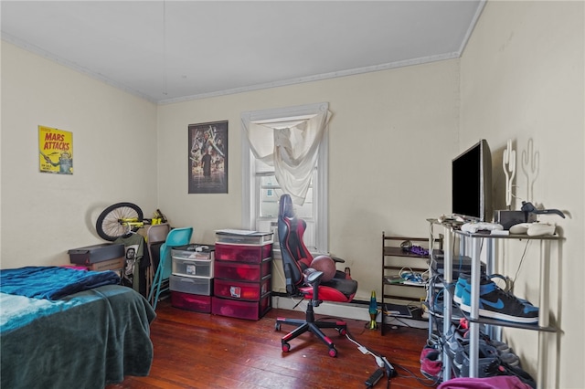 bedroom featuring ornamental molding and dark hardwood / wood-style flooring