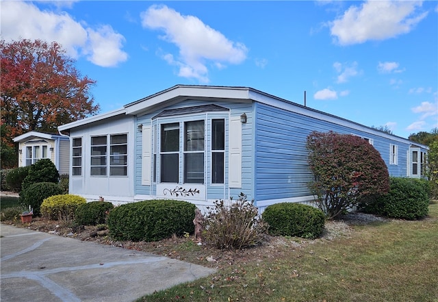 view of home's exterior featuring a lawn