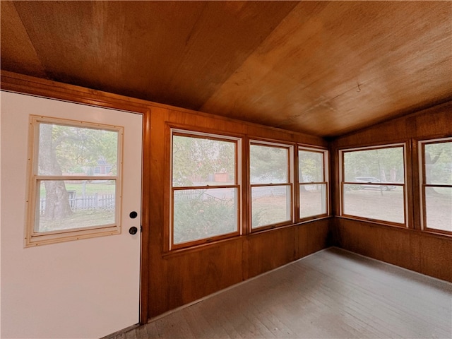 unfurnished sunroom with lofted ceiling and wood ceiling