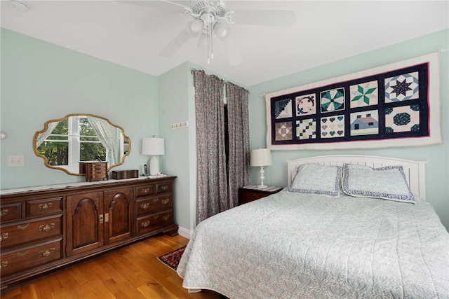 bedroom with ceiling fan and light hardwood / wood-style flooring