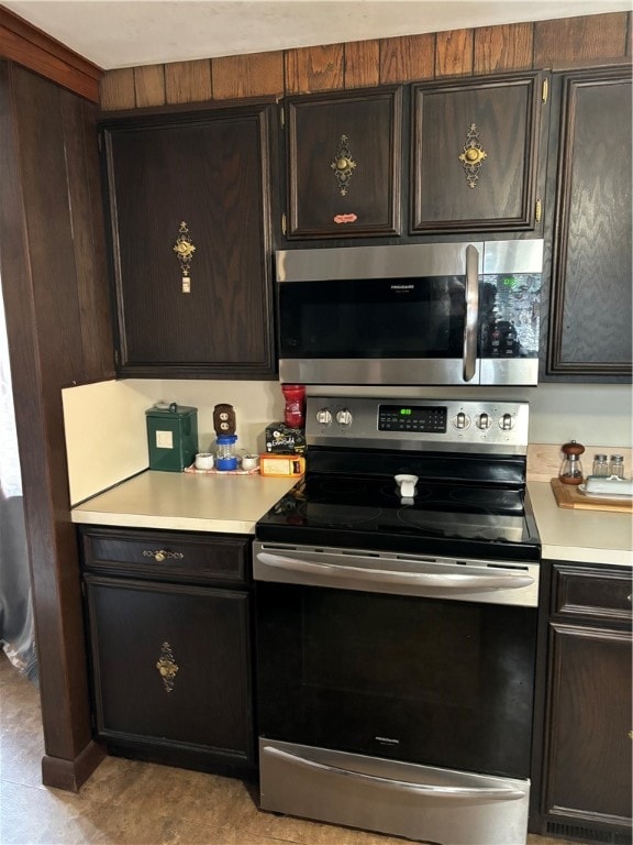 kitchen featuring dark brown cabinets and stainless steel appliances