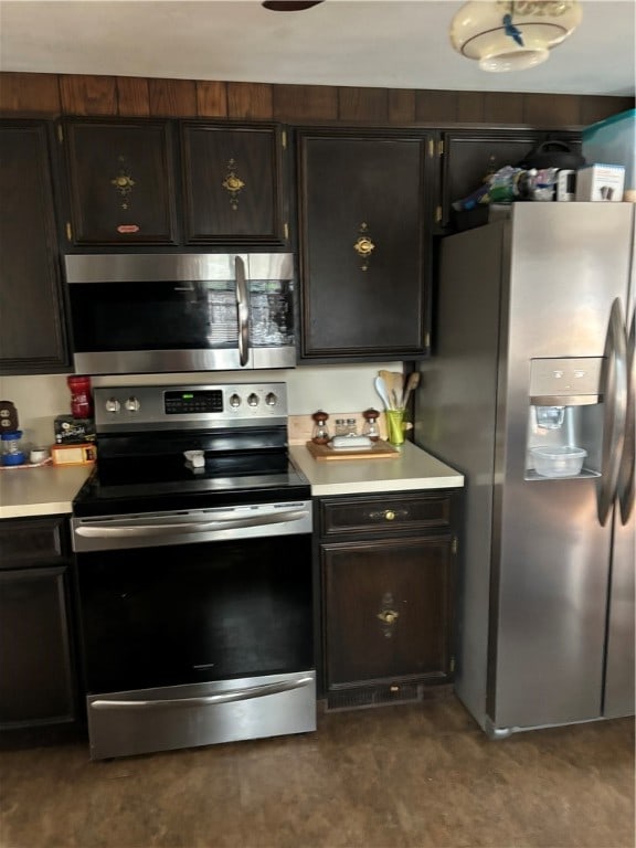 kitchen featuring dark brown cabinets and stainless steel appliances