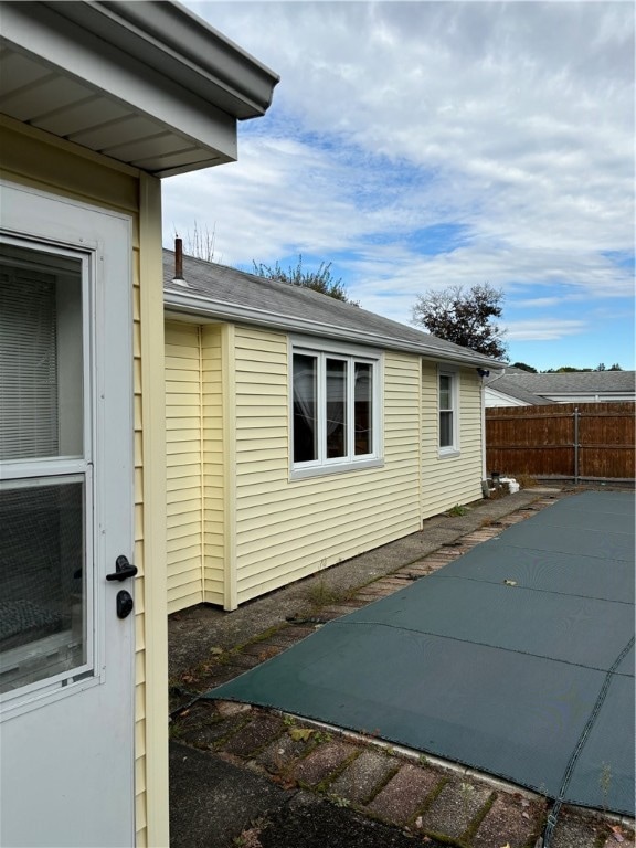 view of side of property with a patio area