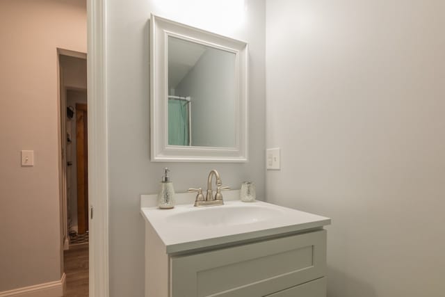 bathroom featuring vanity and hardwood / wood-style floors