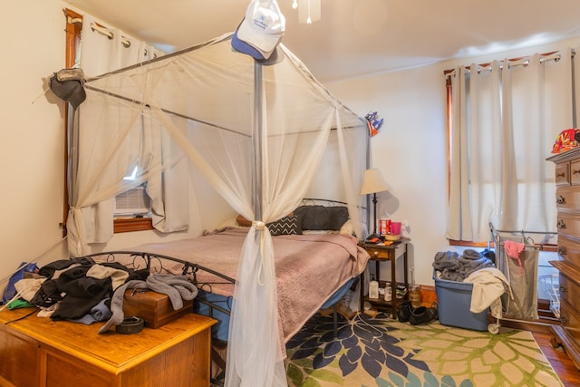 bedroom featuring cooling unit and hardwood / wood-style flooring