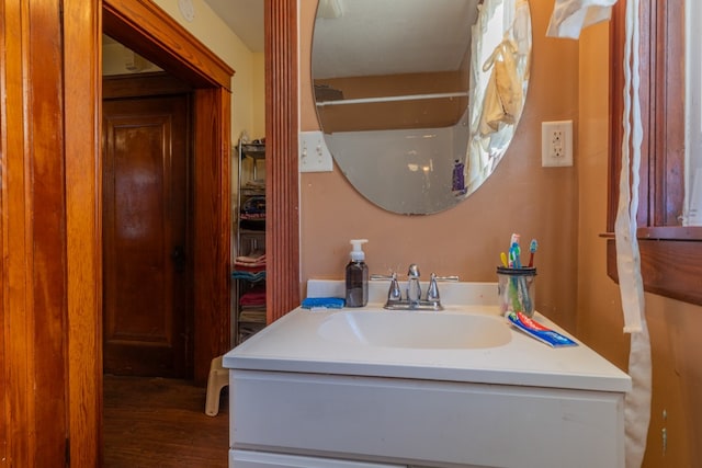 bathroom featuring hardwood / wood-style flooring and vanity