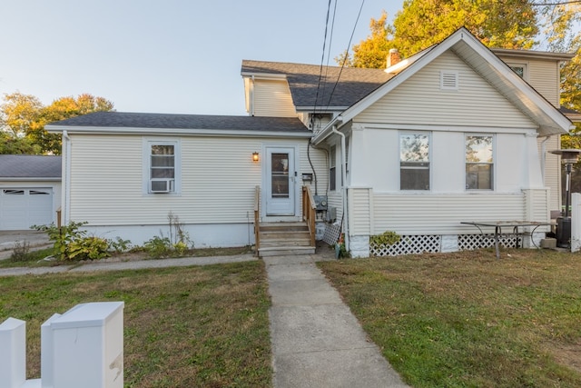 view of front of home featuring a garage and a front yard