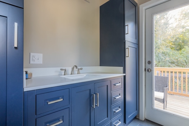 bathroom featuring tile patterned flooring and vanity