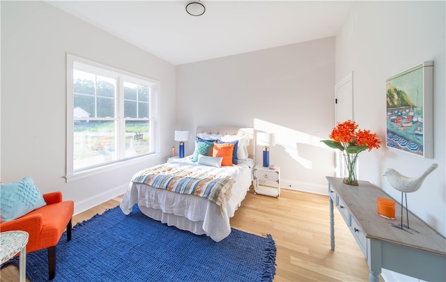 bedroom with light hardwood / wood-style flooring