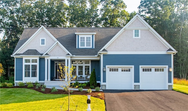 craftsman-style house with a front yard and a garage