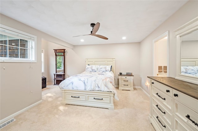 bedroom featuring ceiling fan and light colored carpet