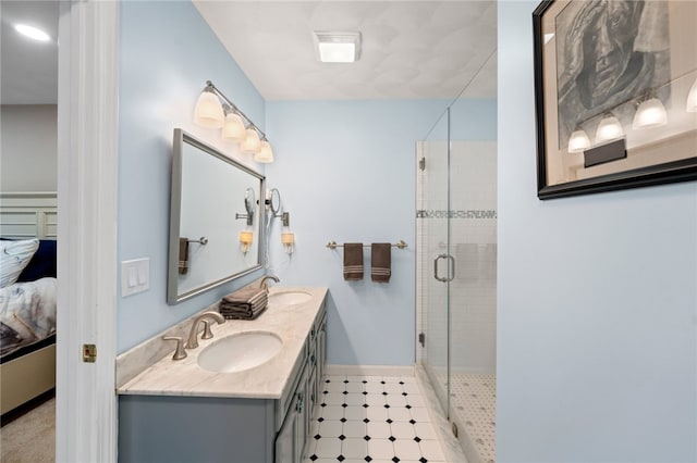 bathroom with walk in shower and vanity