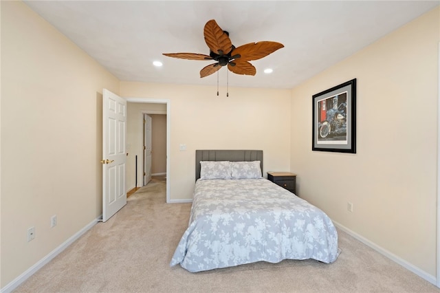 bedroom featuring ceiling fan and light colored carpet