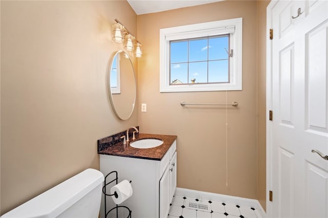 bathroom with vanity and toilet