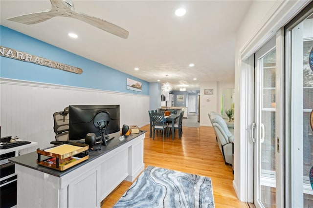 office space featuring ceiling fan and light hardwood / wood-style flooring