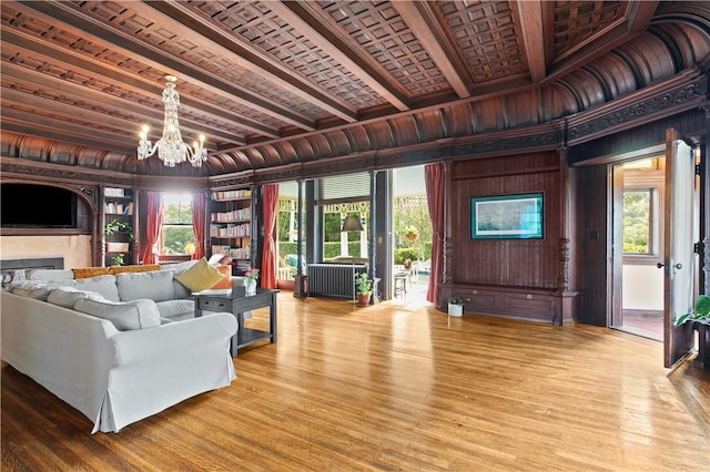 68 Kay St, Newport, RI 02840 - living area with wooden walls, beamed ceiling, an inviting chandelier, and wood finished floors