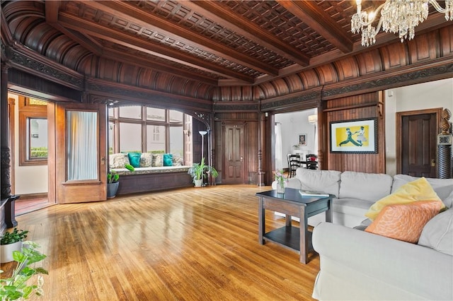 68 Kay St, Newport, RI 02840 - living area with wooden walls, beam ceiling, a chandelier, and hardwood / wood-style floors