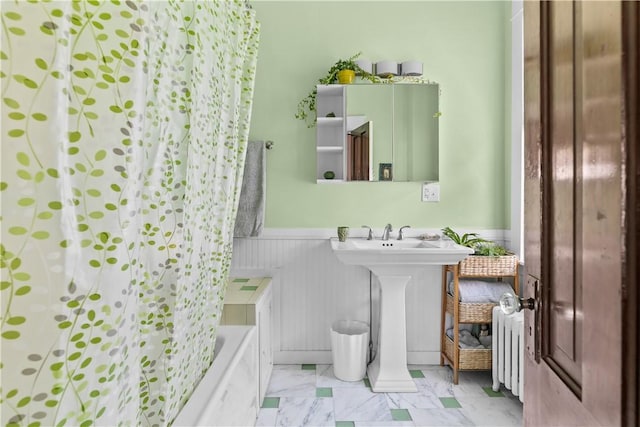 68 Kay St, Newport, RI 02840 - bathroom with marble finish floor, radiator heating unit, a wainscoted wall, a sink, and shower / tub combo