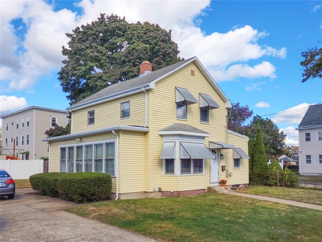 view of front of home with a front yard