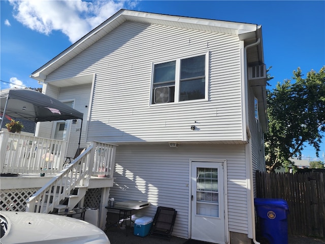 back of property featuring a deck