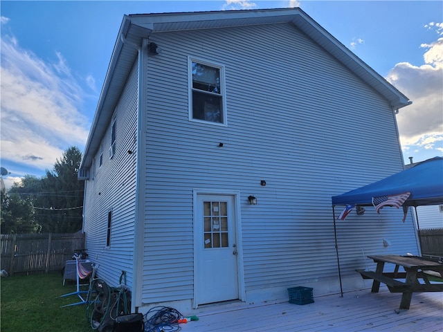 rear view of house featuring a deck