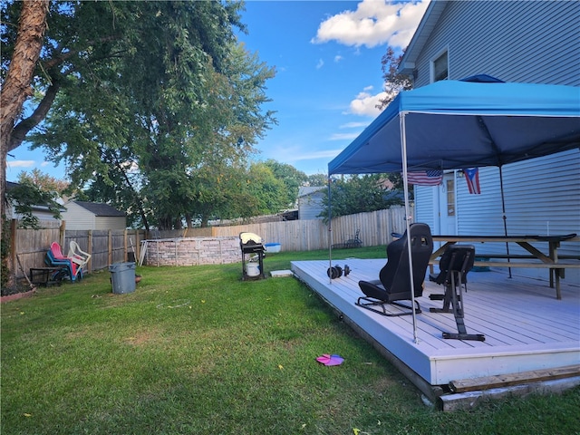 view of yard with a wooden deck