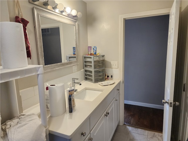 bathroom featuring hardwood / wood-style floors and vanity