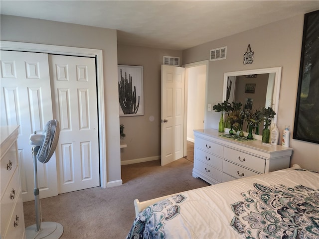 carpeted bedroom with a closet